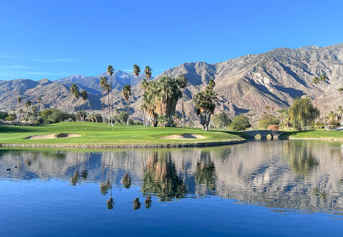 Palm Springs golf course with lake and mountains