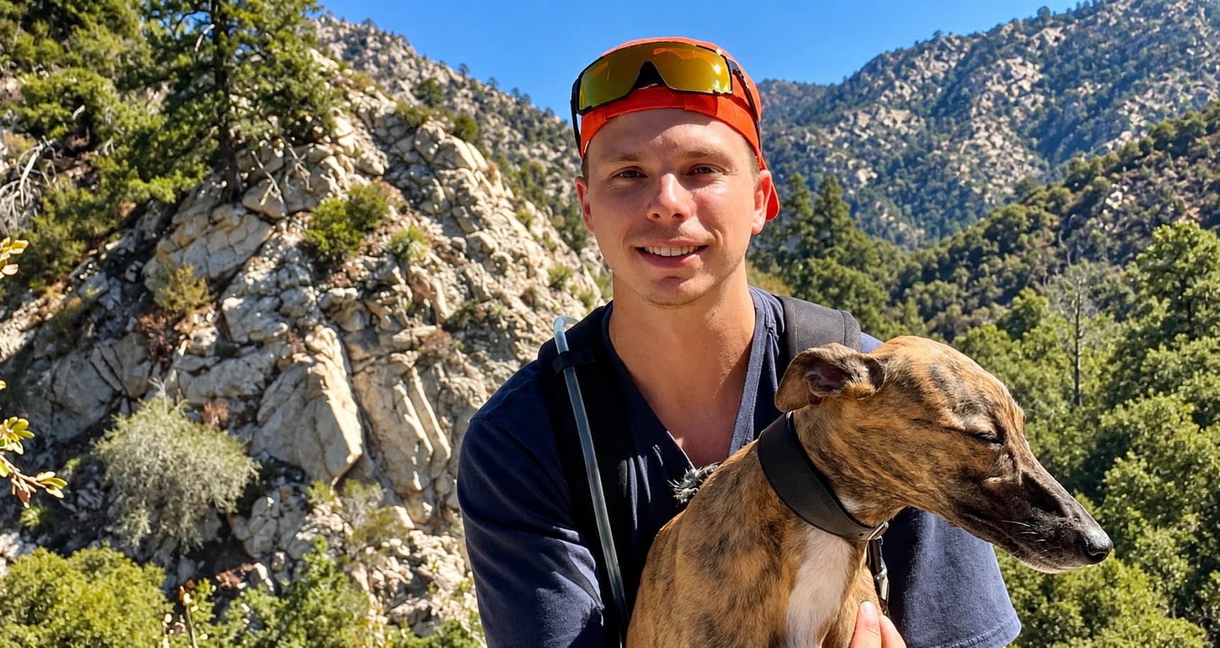 Thomas Falkner (The Dutch Redneck) with his brindle dog in the mountains