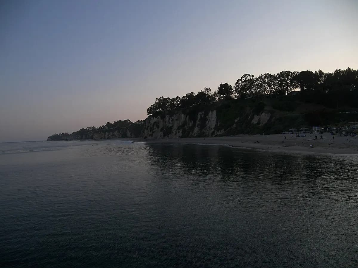 Paradise Cove beach and cliffs in Malibu at dusk
